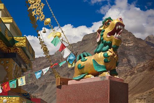 Stone sculpture of Shishi or Lion of Buddha (Buddhist guardian lion with magical properties and power to repel evil spirits) in front of ancient Buddhist monastery Tabo in Spiti (Custom).jpg